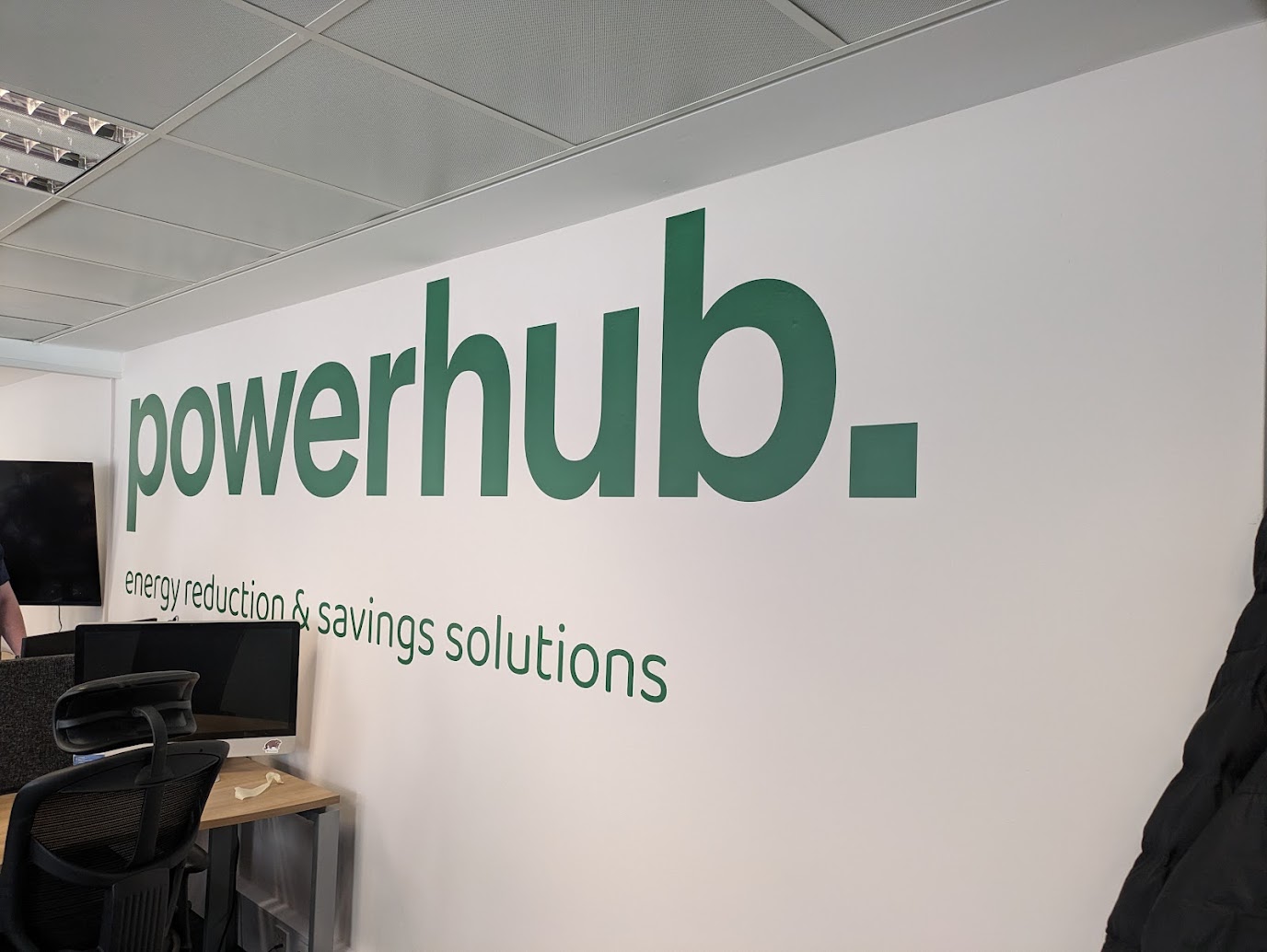 Company Wall Logo Sticker Installed on white wall